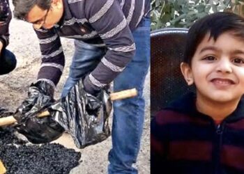 Father-filling-potholes-save-other-kids