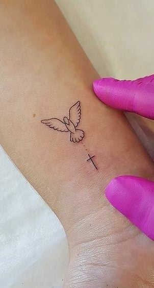 Dove and cross locket tattoo-40