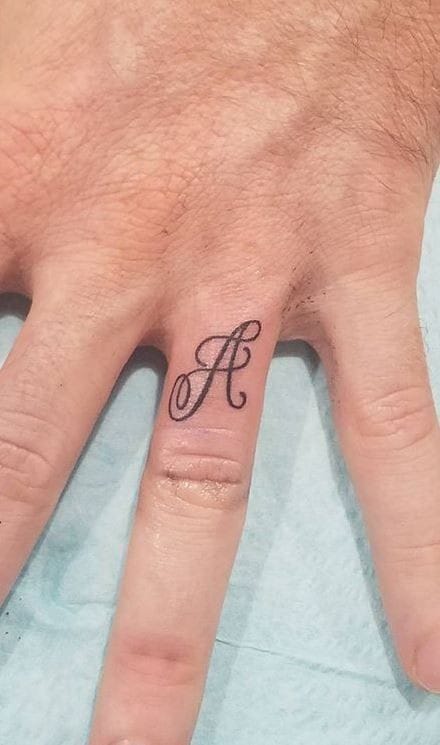 A letter tattoo on finger