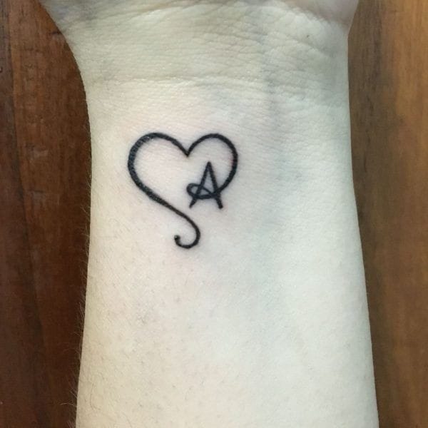 A letter tattoo with heart