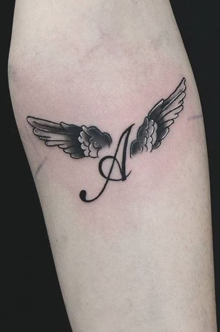 A letter tattoo with wings