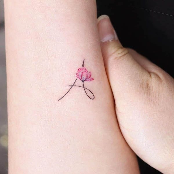 A letter with a flower tattoo