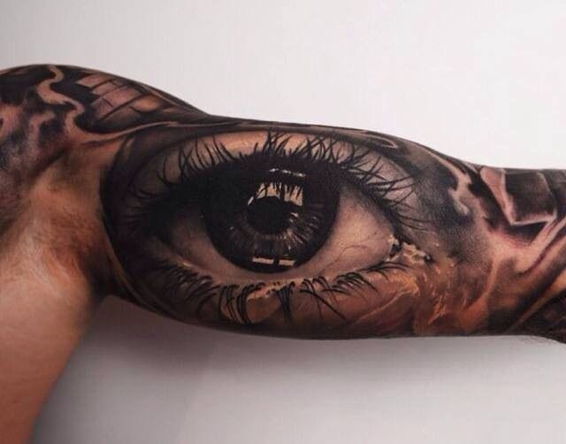 Bicep eye tattoo