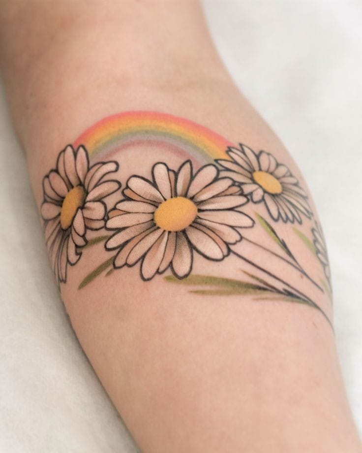 Daisies with a Rainbow tattoo