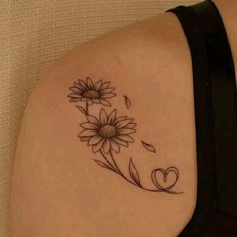 Daisy fine line arm tattoo
