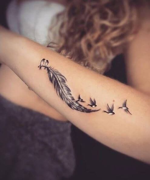 Feathers arm tattoo for women