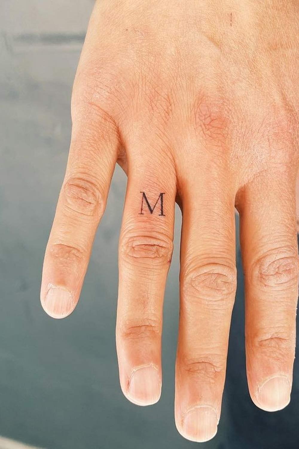 Letter Finger Tattoo