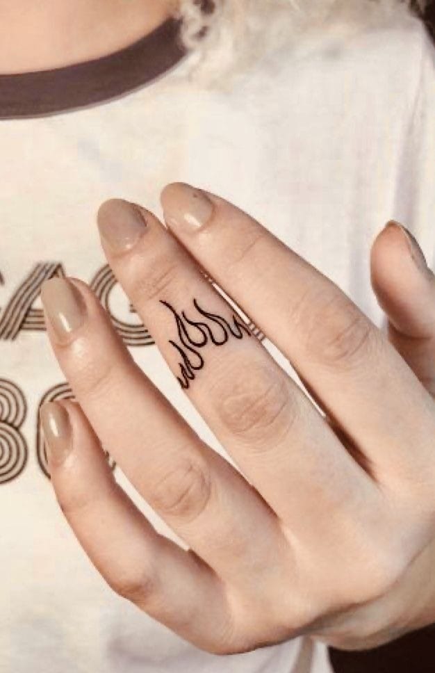 Fire finger tattoo