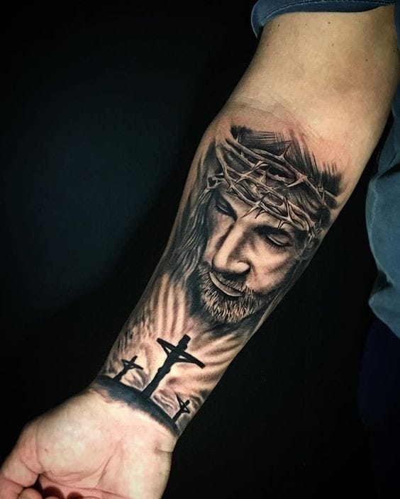 Forearm Jesus tattoo