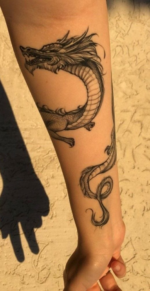 Forearm dragon tattoo