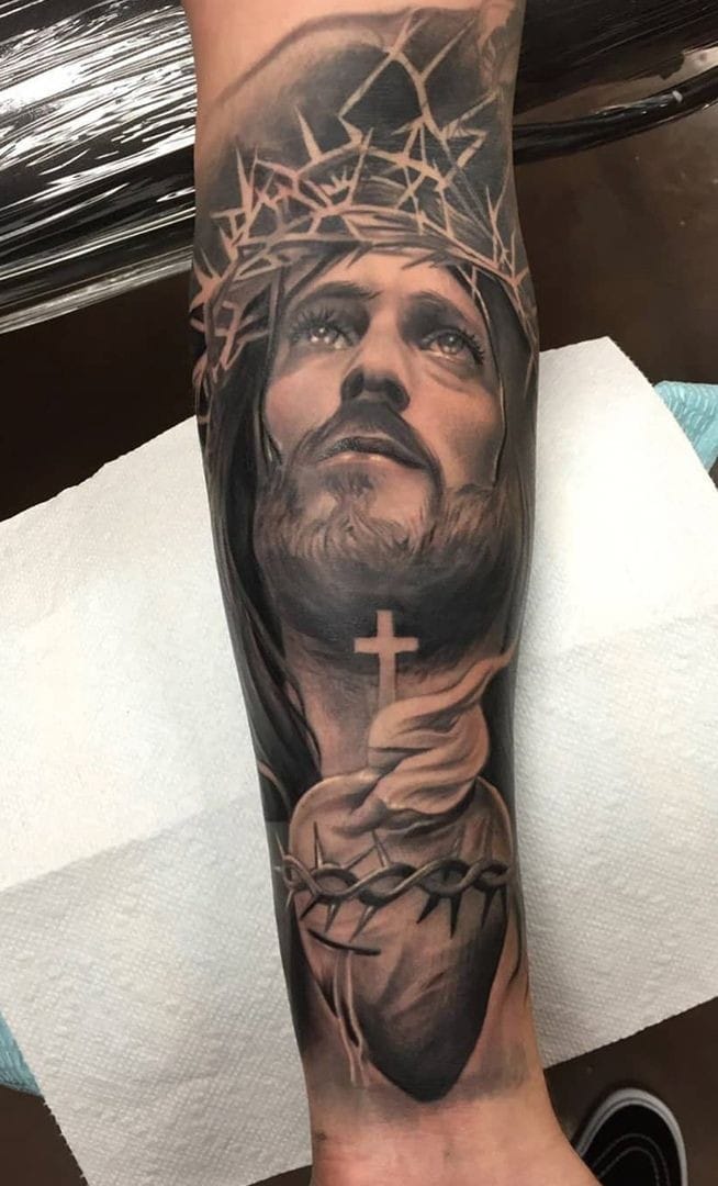 Jesus with a crown of thorns tattoo