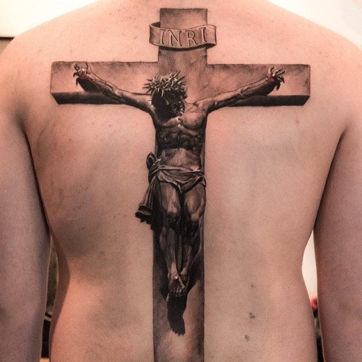 Jesus with the cross in background tattoo