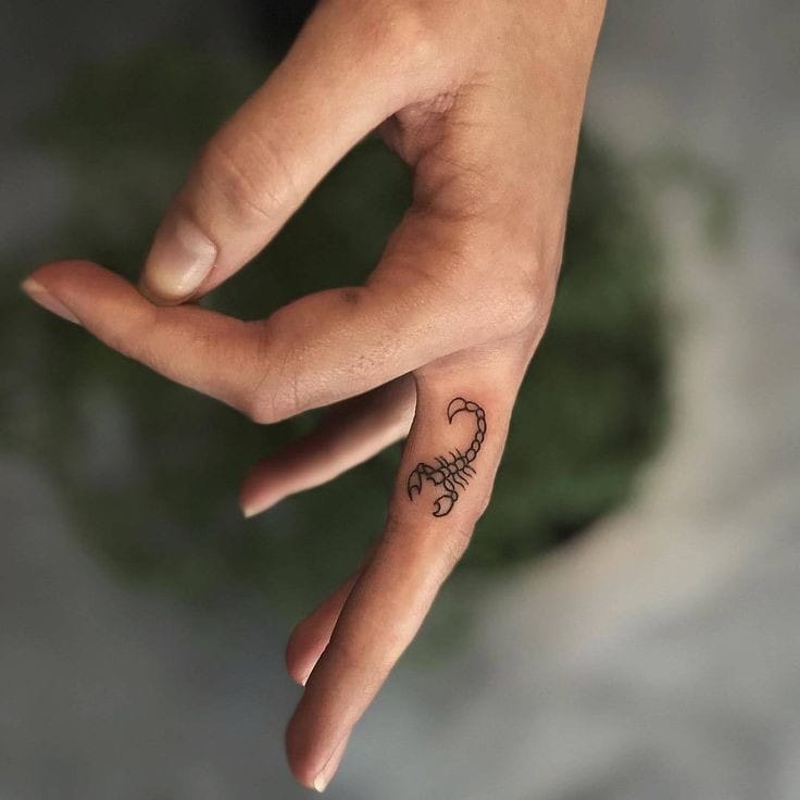 Scorpion finger tattoo