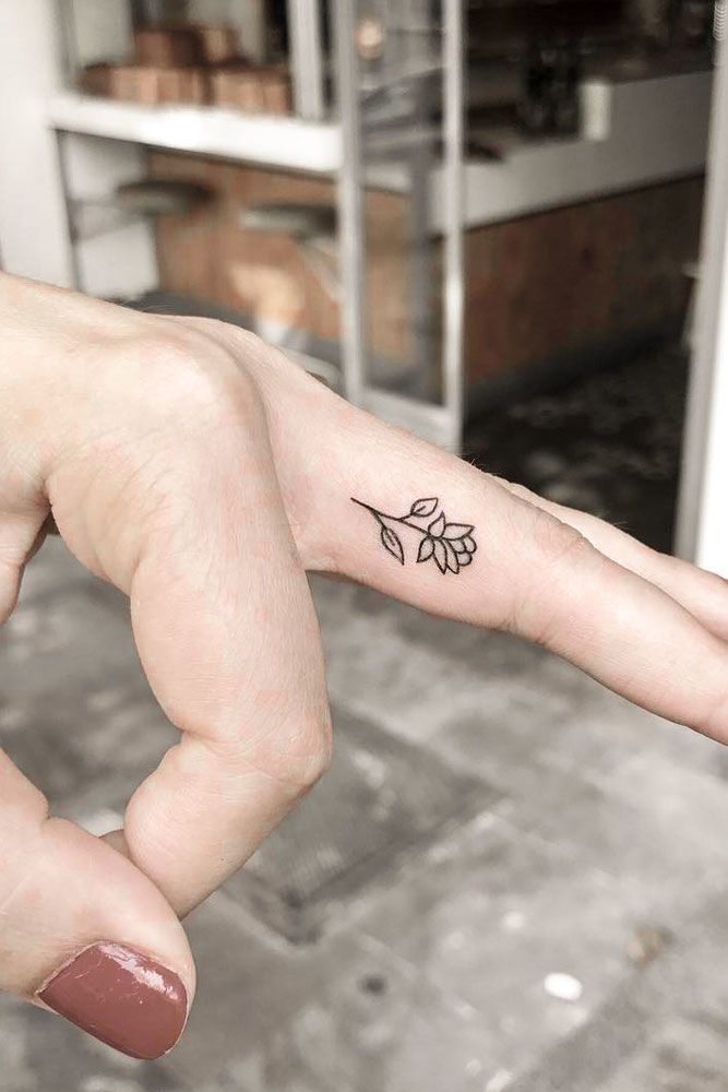 Small Flower Finger tattoo