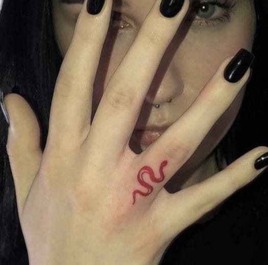 Snake finger tattoo