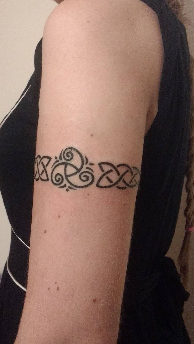 celtic knot arm tattoo for women