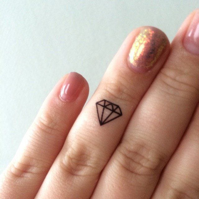 diamond small finger tattoo