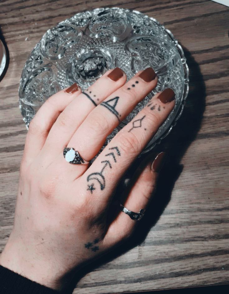 geometric finger tattoo