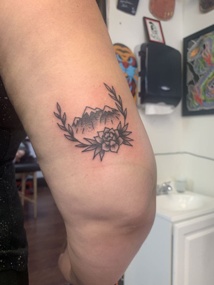 lotus flower mountain range tattoo