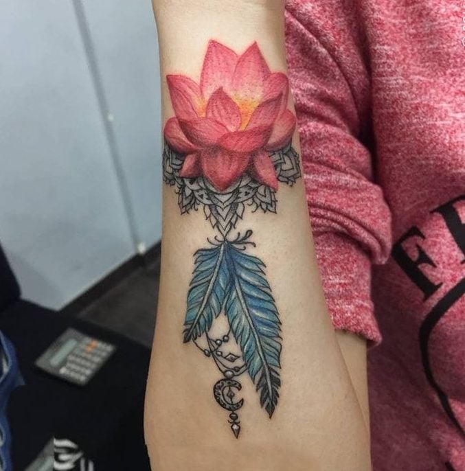 lotus flower with feather tattoo