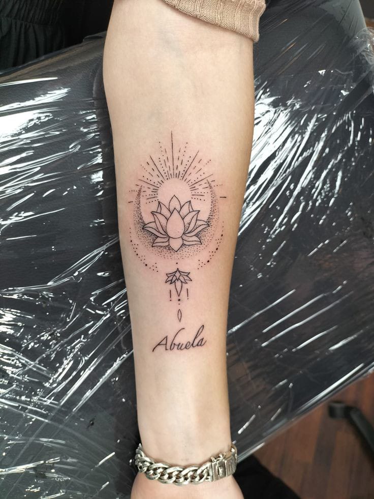 lotus flower with sun tattoo