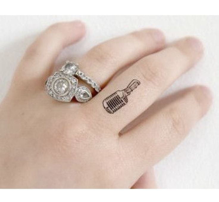 microphone silhouette finger tattoo