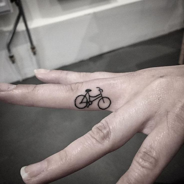 miniature bicycle finger tattoo