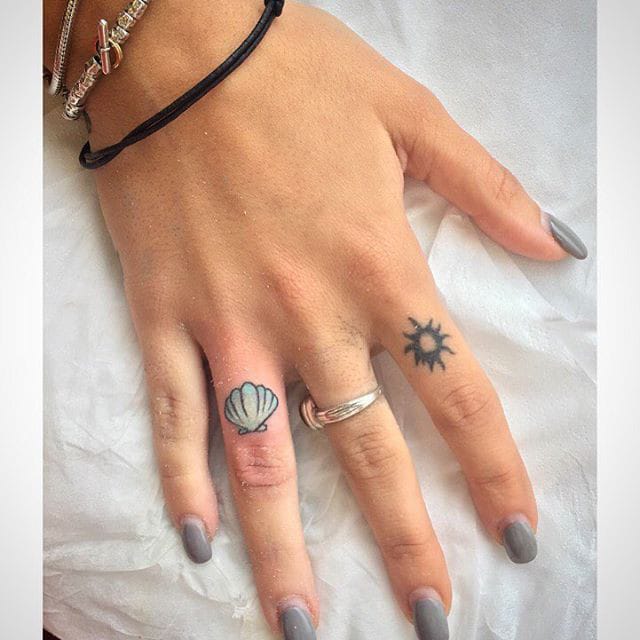 seashells finger tattoo