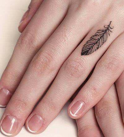 simple feather finger tattoo