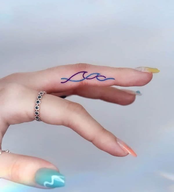 small wave symbol finger tattoo