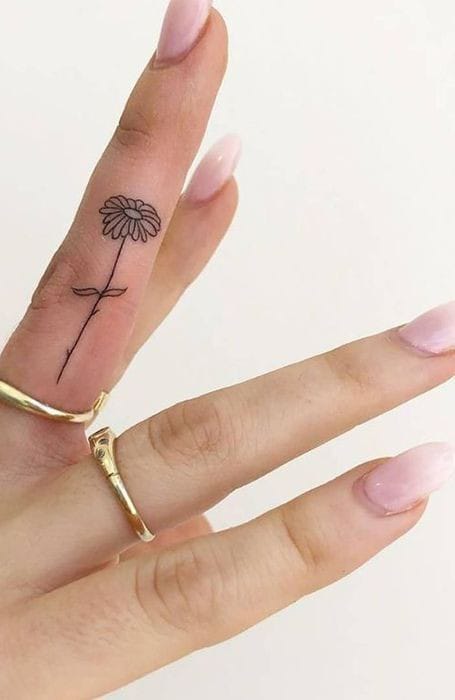 sunflower finger tattoo