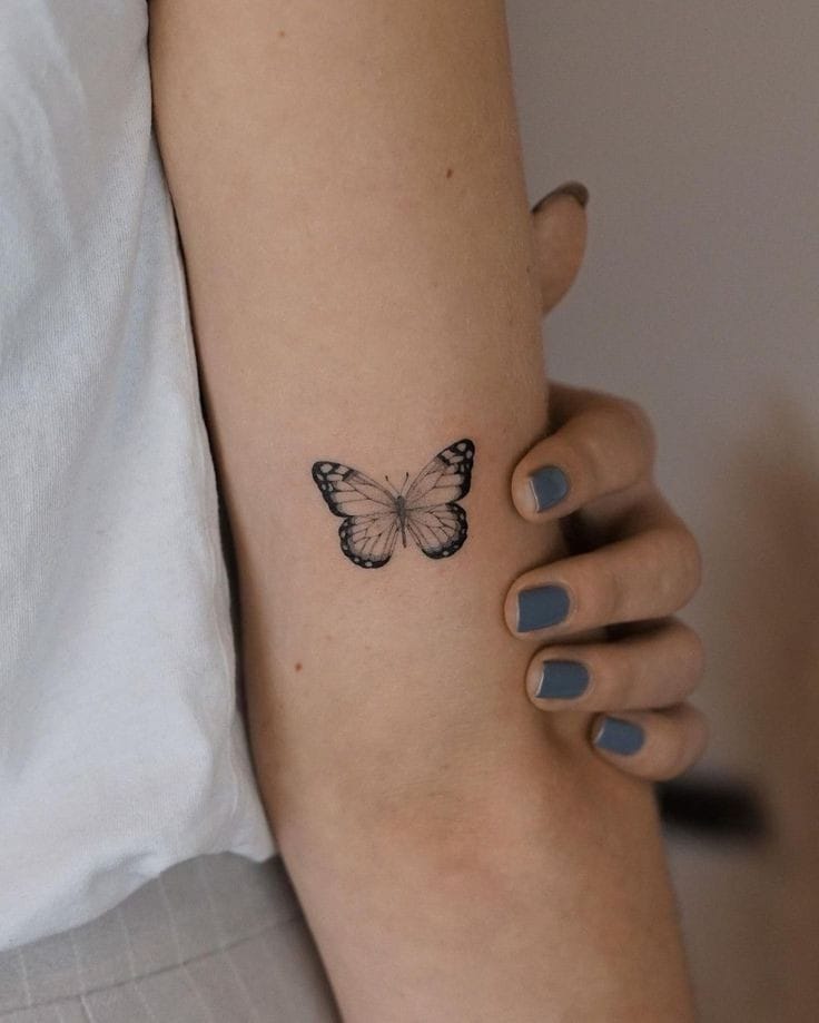 Arm butterfly tattoo