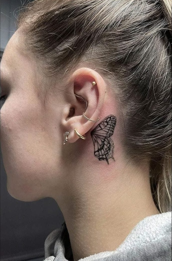 Behind the ear butterfly tattoo