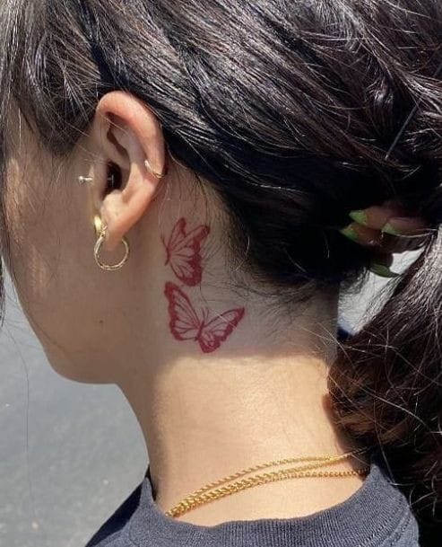 Behind the ear butterfly tattoo