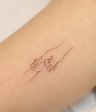 Simple holding hand memorial tattoo-17